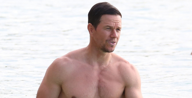 Actor Mark Wahlberg shows off his bulging biceps at the beach in Barbados