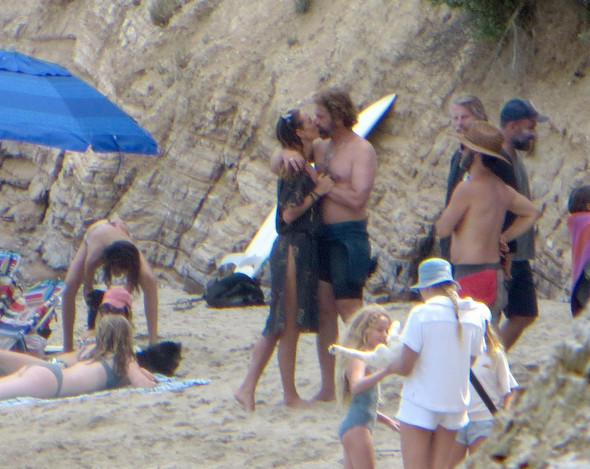 EXCLUSIVE: Gerard Butler shirtless surfing hugging and kissing Morgan Brown
