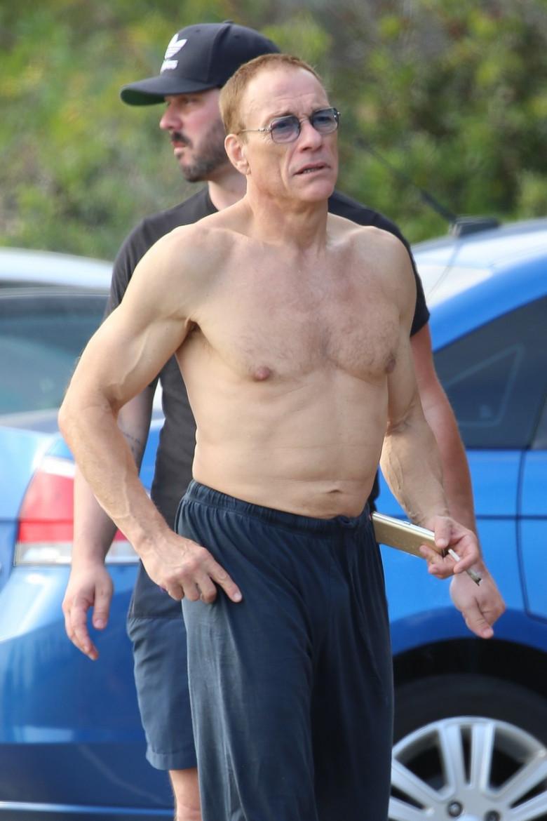 *EXCLUSIVE* A shirtless Jean-Claude Van Damme enjoys a funny-looking cigarette with friends in Malibu!