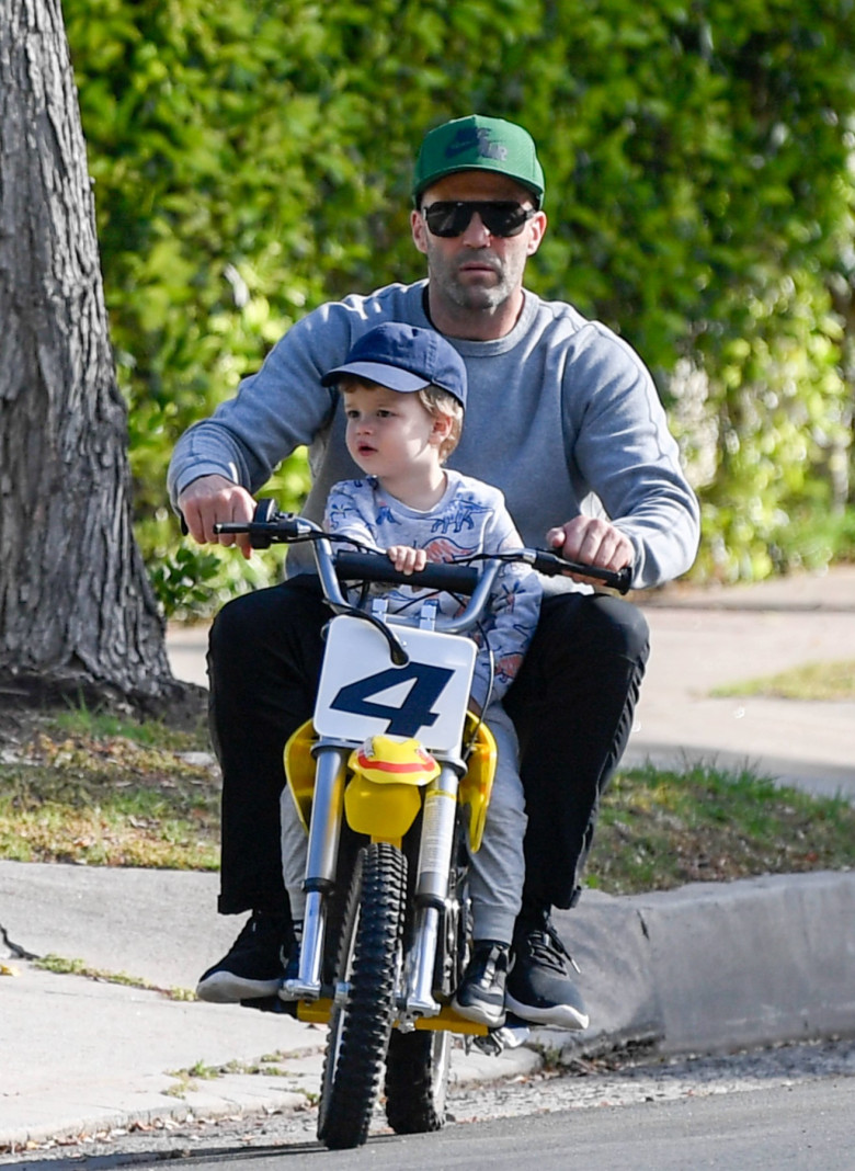 EXCLUSIVE: Jason Statham takes his son Jack for a ride on his Motocross bike