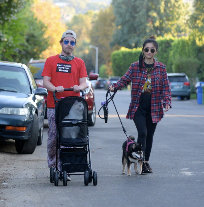 EXCLUSIVE: Macaulay Culkin and Girlfriend Brenda Song Take Their Cat and Dog Out for a Stroll in Los Angeles.
