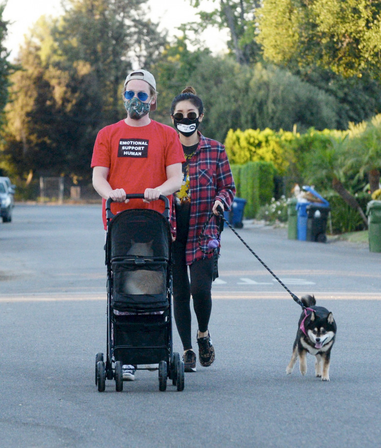 EXCLUSIVE: Macaulay Culkin and Girlfriend Brenda Song Take Their Cat and Dog Out for a Stroll in Los Angeles.