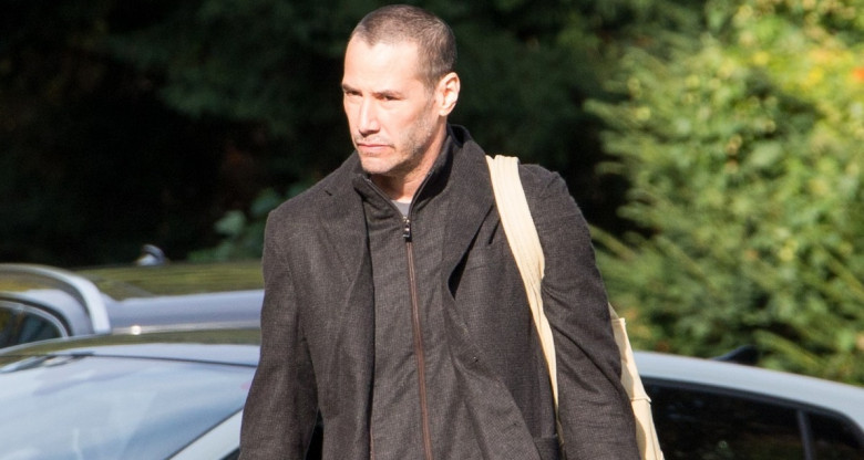 EXCLUSIVE: **PREMIUM EXCLUSIVE RATES APPLY**Keanu Reeves reveals a army buzz haircut when he is brought to his hotel by girlfriend Alexandra Grant on Sunday in Berlin, Germany.