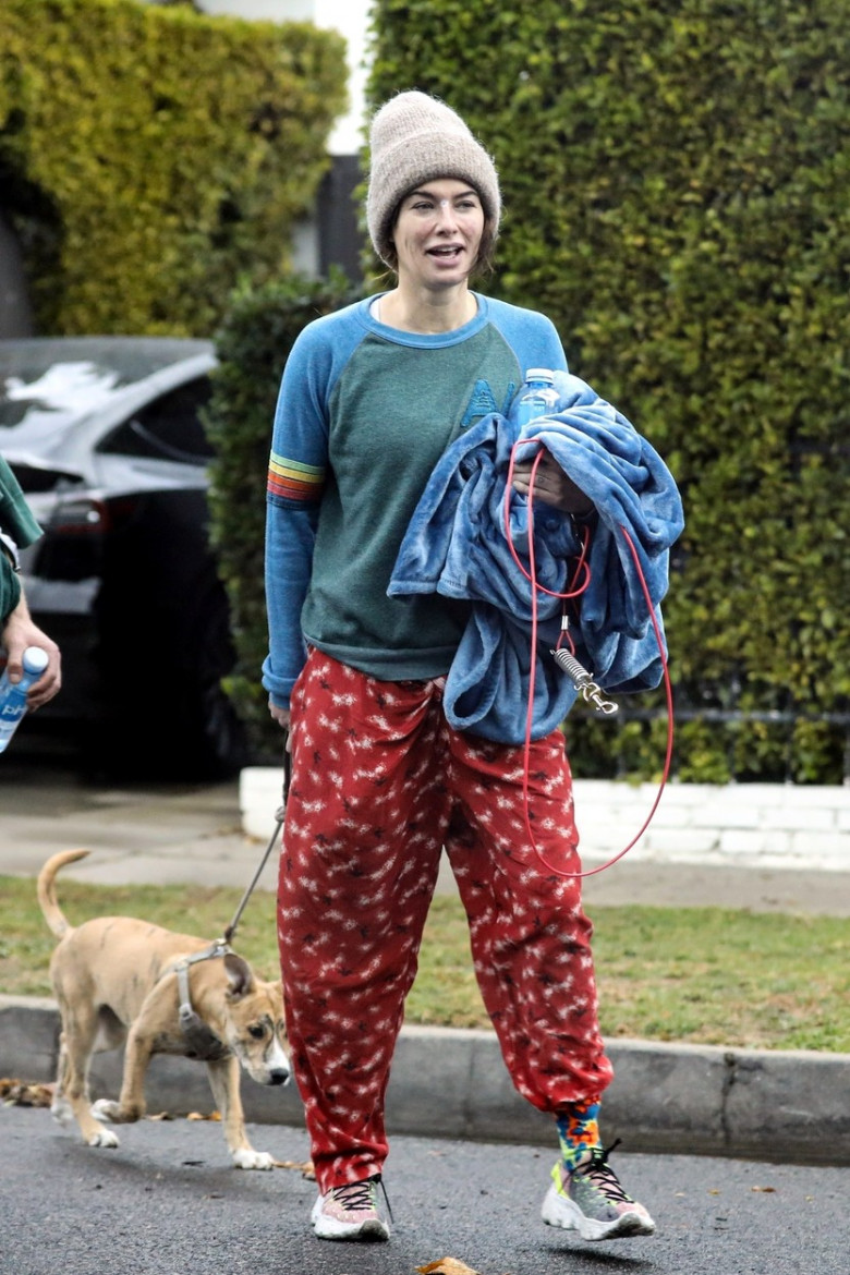 *EXCLUSIVE* Lena Headey and Marc Menchaca all smiles leaving the gym with their Puppy