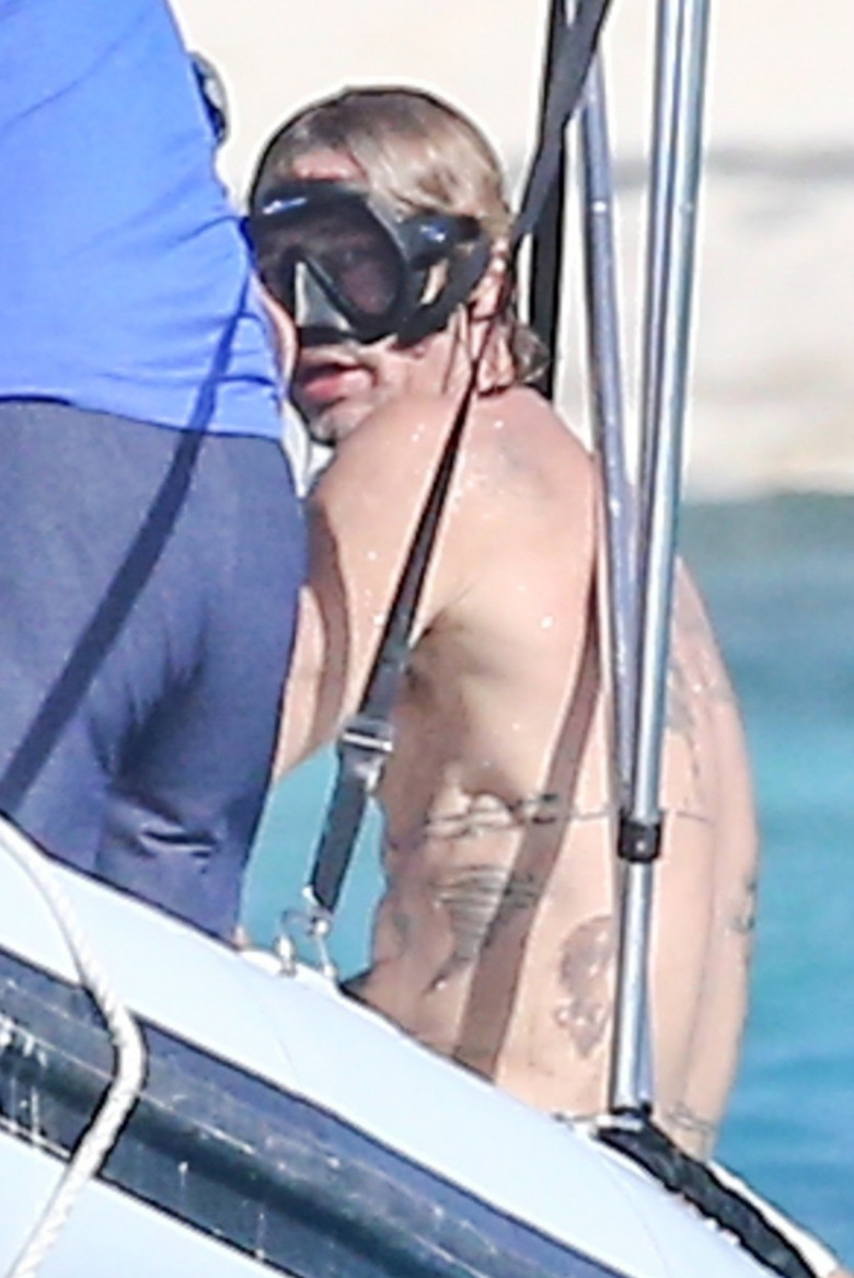 *PREMIUM-EXCLUSIVE* Brad Pitt shows off his MANY back tattoos during a getaway to Turks and Caicos with good pal Flea