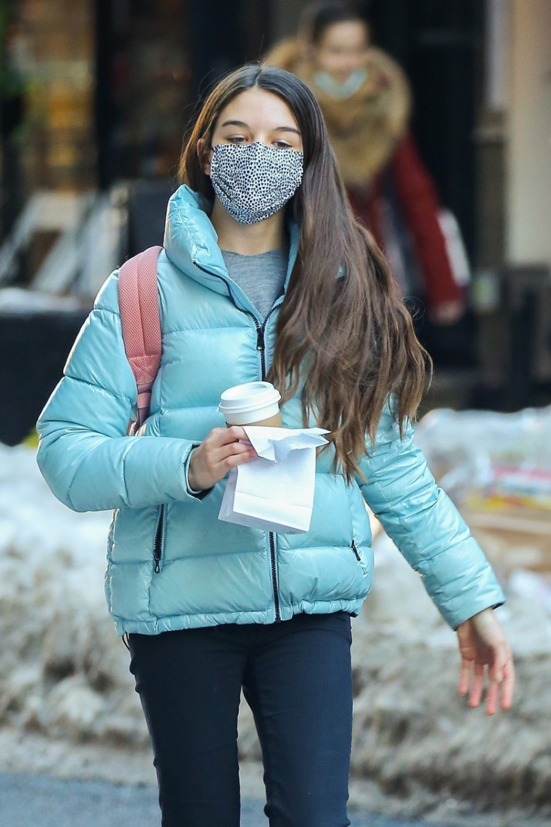 *EXCLUSIVE* Suri Cruise looks stylish in a light blue Colmar jacket and a pink bag pack grabbing coffee in NYC