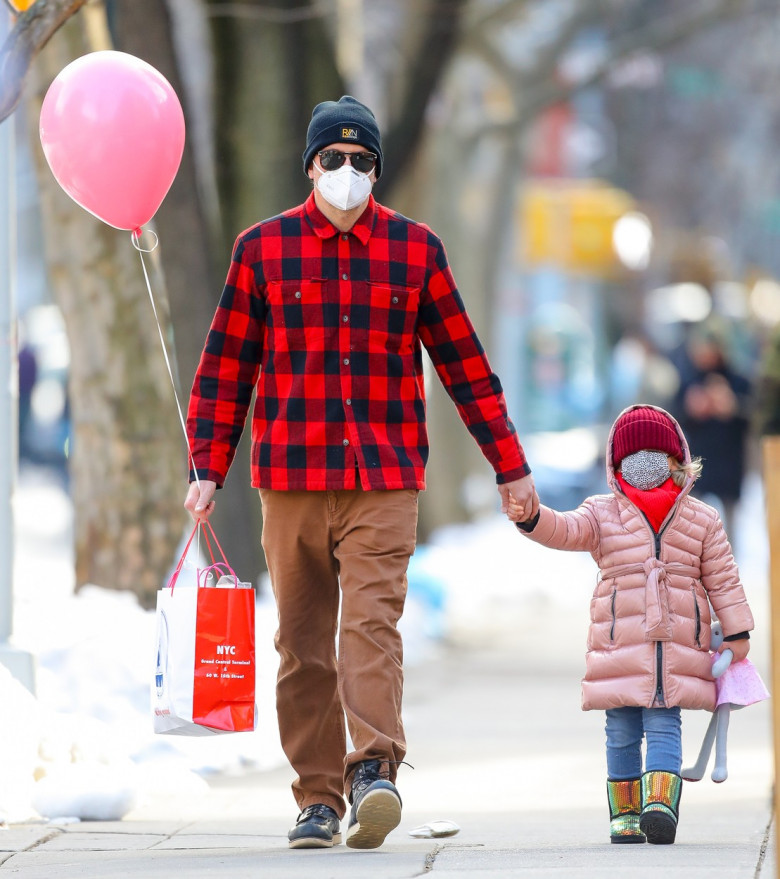 EXCLUSIVE: Bradley Cooper Holds A Pink Ballon While Hand-In-Hand With Daughter Lea De Seine Shayk Cooper As They Take A Stroll In New York City