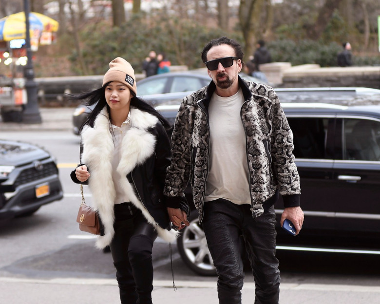 Nicolas Cage and his girlfriend matching black leather pants while going insid THE American Museum of Natural History