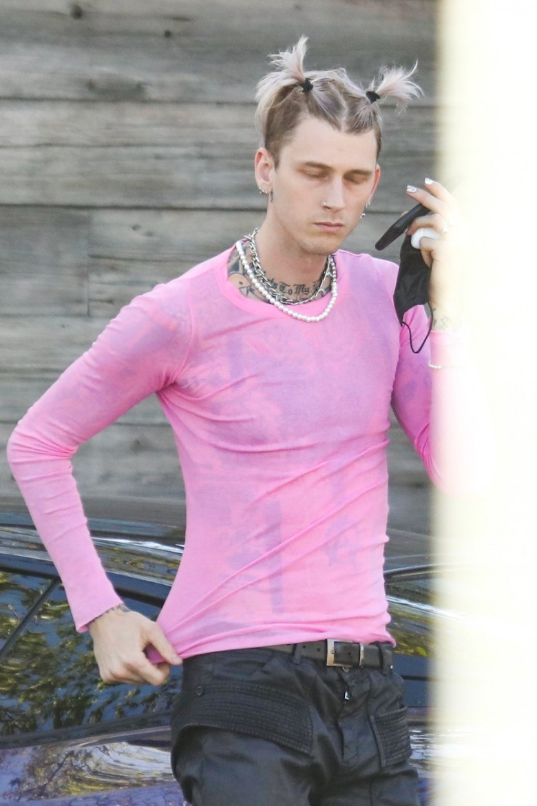 *EXCLUSIVE* Machine Gun Kelly supports International Women's Day with pink top!