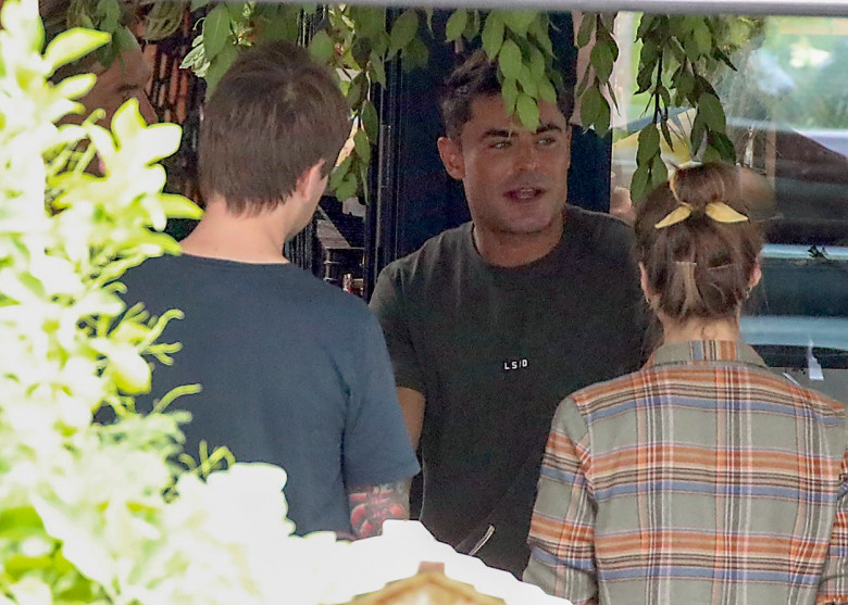 EXCLUSIVE: *NO DAILYMAIL ONLINE* Zac Efron Is Seen Filming His New Show "Down To Earth With Zac Efron" At The Suitability House At Federation Square In Melbourne