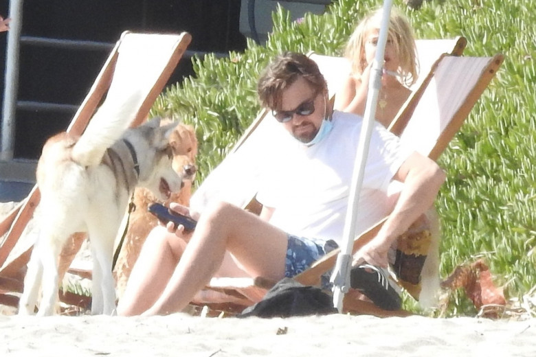 *EXCLUSIVE* Leonardo DiCaprio and Camila Morrone hang with friends and Leo's pal Emile Hirsch at Malibu Beach **WEB EMBARGO UNTIL 1 PM EDT on March 29, 2021** - ** WEB MUST CALL FOR PRICING **