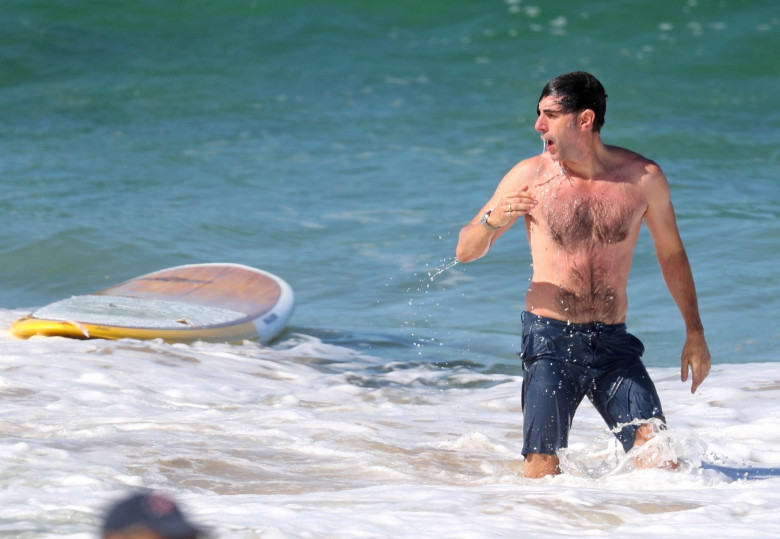 *EXCLUSIVE* Sacha Baron Cohen and Isla Fisher soak up some couple time together on the beach on the South Coast
