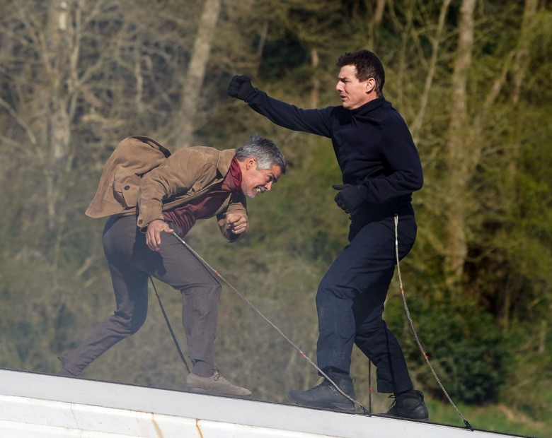 *STRICTLY NOT AVAILABLE FOR DAILY MAIL ONLINE USAGE* The all action American Hero Tom Cruise fights with Esai Morales during a daring scene on top of a train from Mission Impossible 7 which is being filmed in North Yorkshire.