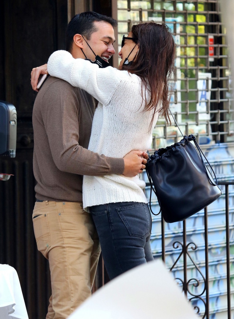 Katie Holmes and Emilio Vitolo are all smiles as they continue another steamy make-out session outside his restaurant in NYC