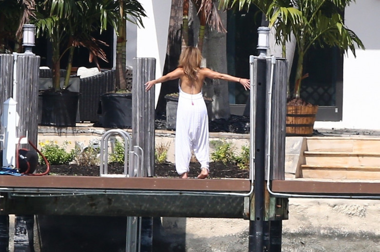 J-Lo puts her mind and body at ease with a stretch at the waterfront in Miami