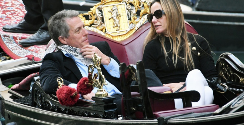 *PREMIUM-EXCLUSIVE* *MUST CALL FOR PRICING* - The British Actor Hugh Grant and wife Anna Elisabet Eberstein pictured looking relaxed and taking selfie's as they enjoy a romantic gondola ride on the Venetian waters on their holiday out in Venice.