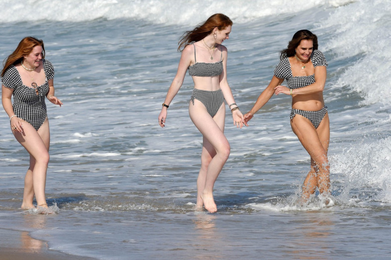 Bikini girl Brooke Shields looks fab at 56 as she dons matching swimwear with daughters for beach day in the Hamptons