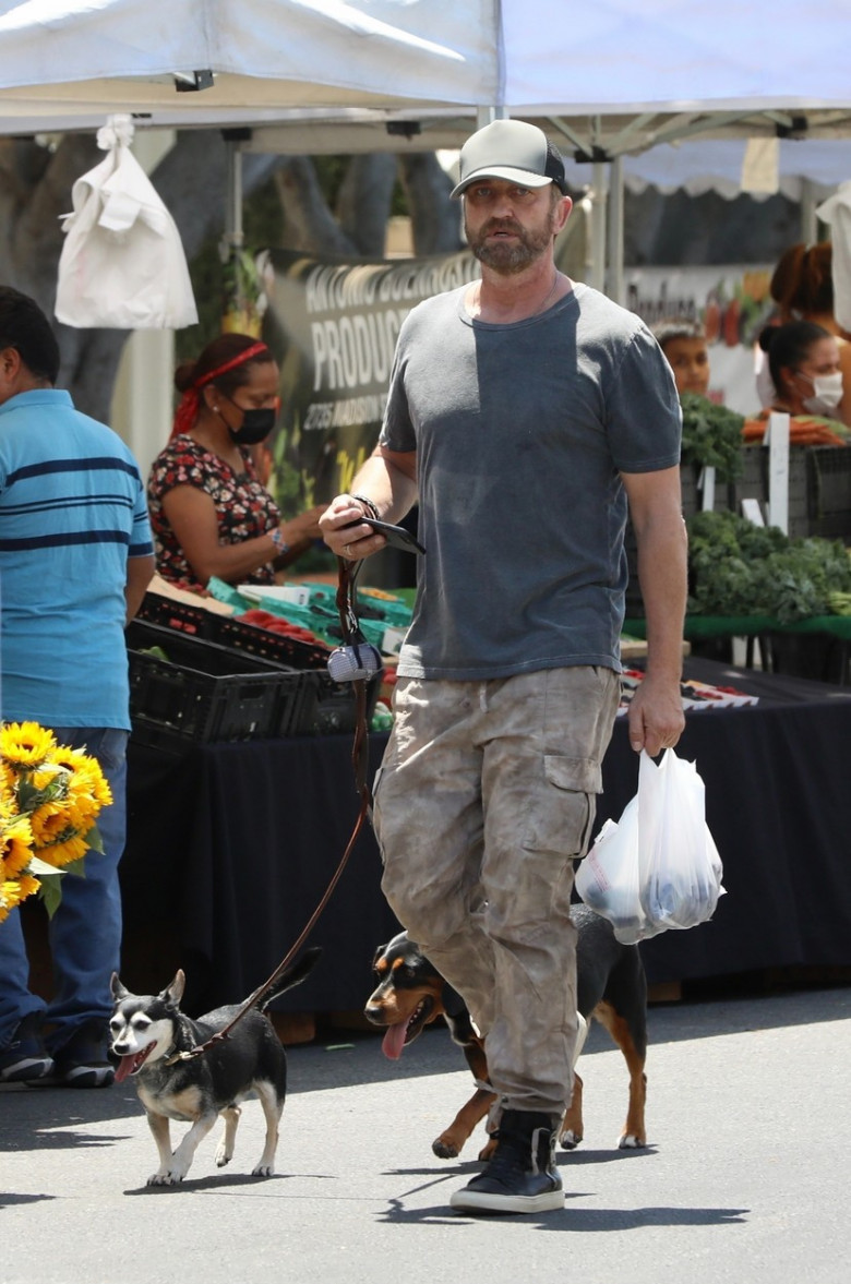 *EXCLUSIVE* Gerard Butler and Morgan Brown share a kiss at the Farmers Market