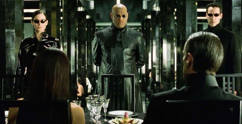 USA. Keanu Reeves , Laurence Fishburne and Carrie-Anne Moss in a scene from the ©Warner Bros film : The Matrix Reloaded (2003).Plot: Neo and his allies race against time before the machines discover the city of Zion and destroy it. While seeking the trut