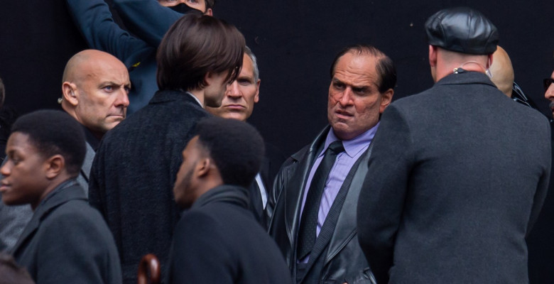 Robert Pattinson and a unrecognizable Colin Farrell are seen on the film set of Batman.
