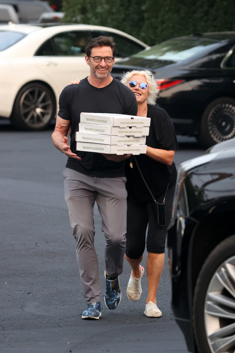 EXCLUSIVE: Hugh Jackman Is All Smiles While Picking Up Pizza With Wife Deborra-Lee Furness In The Hamptons.