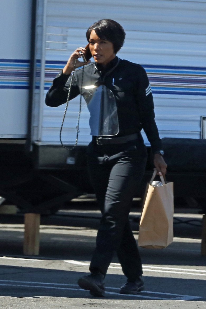 EXCLUSIVE: Angela Bassett dressed as a police officer on the set of 9.1.1