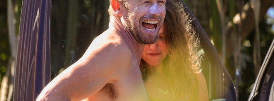 EXCLUSIVE: *NO DAILYMAIL ONLINE* Simon Baker Suffers A Cheeky Wetsuit Wardrobe-Malfunction During A Surf Session With Girlfriend Laura May Gibbs In Byron Bay