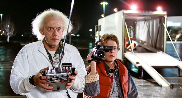 USA. Michael J. Fox and Christopher Lloydin a scene from ©Universal Pictures film: Back to the Future (1985).Plot: Marty McFly, a 17-year-old high school student, is accidentally sent thirty years into the past in a time-traveling DeLorean invented by
