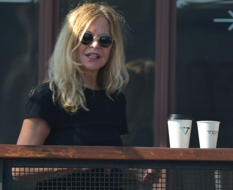EXCLUSIVE: Actress Meg Ryan Looks Upbeat As She Steps Out For Coffee After Talk Show Host Michael Parkinson Apologizes Over Car Crash TV Interview 18 Years Ago.