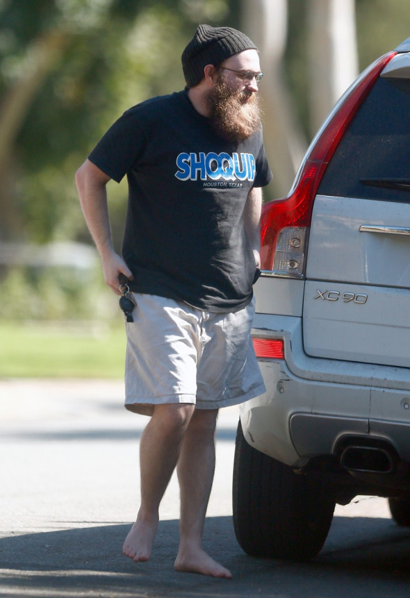 Reclusive former child star Angus T Jones is unrecognizable from his Two and a Half Men days as he strolls around LA barefoot and sporting a thick bushy beard.