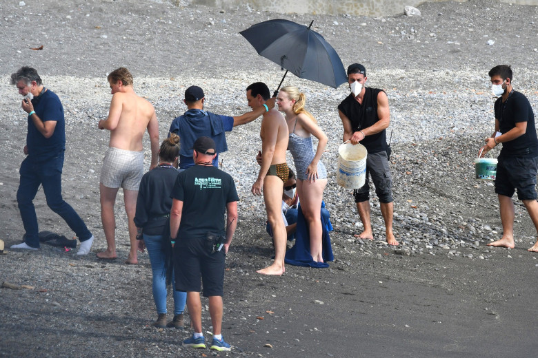 EXCLUSIVE: Dakota Fanning seen in a one-piece swimsuit filming "Ripley" in Strani, Amalfi Coast