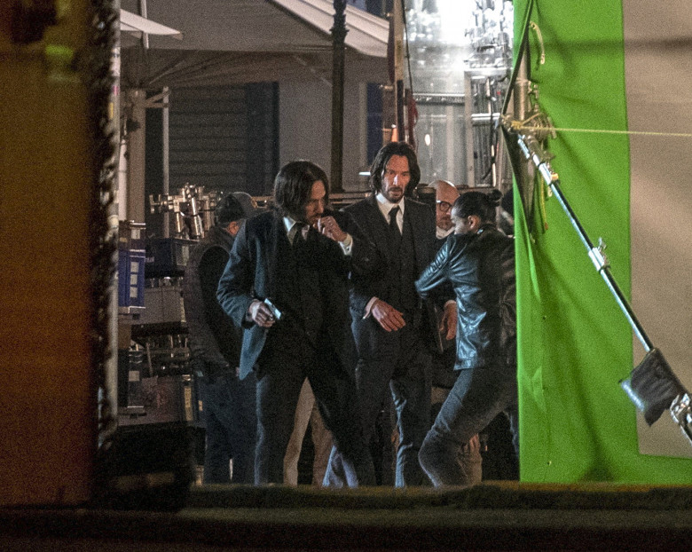 EXCLUSIVE: Keanu Reeves finishes filming "John Wick 4" with a night shoot at Gendarmenmarkt square in Berlin, Germany.