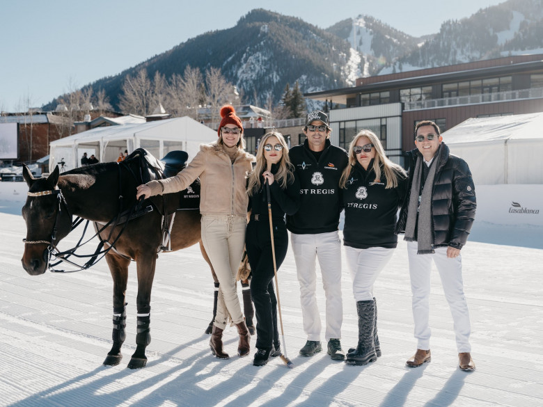 Kate Hudson poses on a horse and with a giant dog at the St. Regis World Snow Polo Championship in Aspen, Colorado