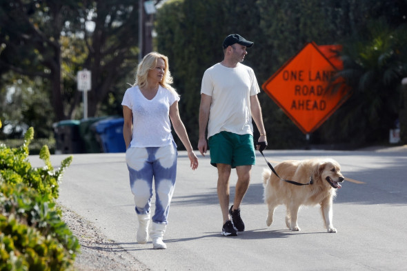 *EXCLUSIVE* Pamela Anderson and husband Dan Hayhurst take the dog for a walk in Malibu