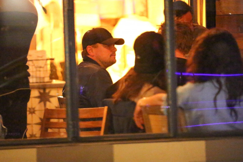*EXCLUSIVE* Leonardo DiCaprio and Tobey Maguire have a boys night out with a group of friends and pretty girls. Tobey is seen having laughs with a beautiful young girl.