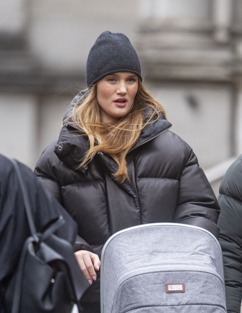 *EXCLUSIVE* WEB MUST CALL FOR PRICING  - STRICTLY NOT AVAILABLE FOR ANY SUBSCRIPTION DEALS - Model Rosie Huntington-Whiteley and fiancé Jason Statham look smiley as they step out pushing the pram with their new baby daughter Isabella.