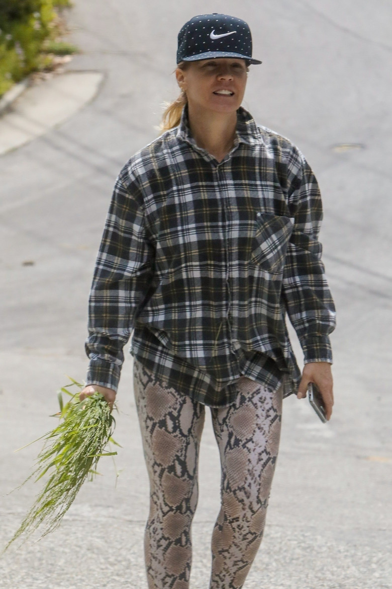 *EXCLUSIVE* Jennie Garth goes for a walk with her daughter before a grocery run with husband Dave Abrams
