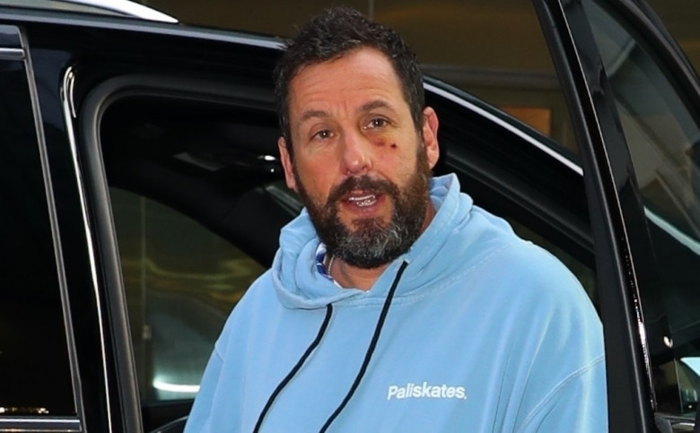 Adam Sandler shows love to his fans as he makes his way to Monday dinner in NYC with a black eye