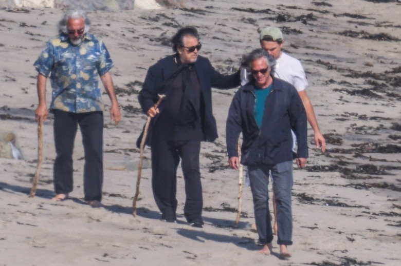 *EXCLUSIVE* Leonardo DiCaprio gets BEHIND the camera to snap pics of his dad and Al Pacino while out for a walk on the beach in Malibu - ** WEB MUST CALL FOR PRICING **