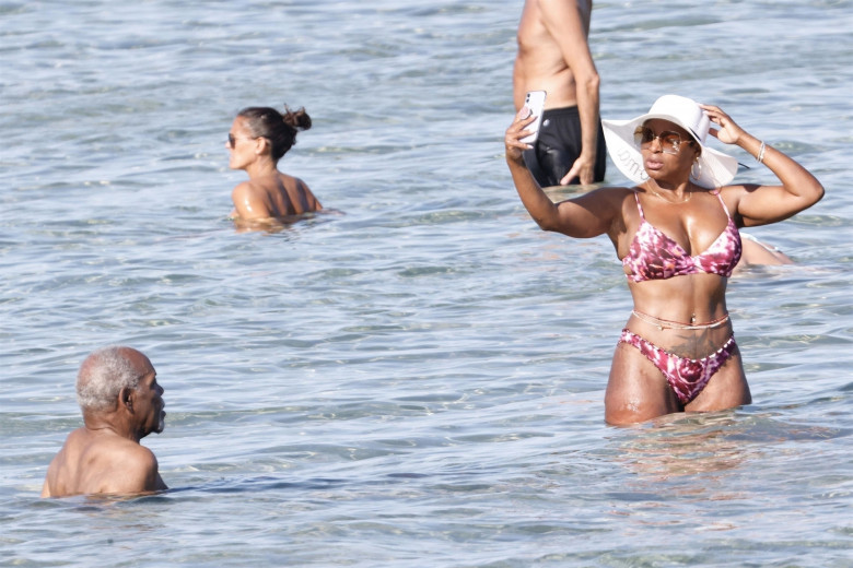 *EXCLUSIVE* *WEB MUST CALL FOR PRICING* The American actor Danny Glover is spotted finding the heat a little too much as he cools down in the sea with his wife Eliane Cavalleiro on his holidays in Sardinia