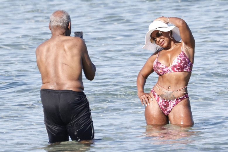 *EXCLUSIVE* *WEB MUST CALL FOR PRICING* The American actor Danny Glover is spotted finding the heat a little too much as he cools down in the sea with his wife Eliane Cavalleiro on his holidays in Sardinia