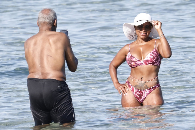 *EXCLUSIVE* *WEB MUST CALL FOR PRICING* The American actor Danny Glover is spotted finding the heat a little too much as he cools down in the sea with his wife Eliane Cavalleiro on his holidays in Sardinia