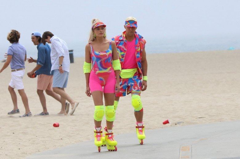 Margot Robbie and Ryan Gosling film scenes for 'Barbie' in fun neon roller skates