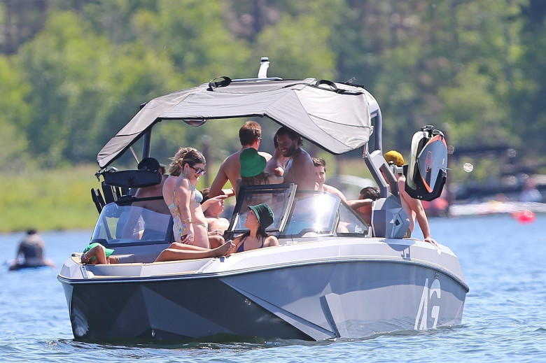 *EXCLUSIVE* *WEB EMBARGO UNTIL JULY 4, 2022 8:30 PM ET* Olivia Jade Giannulli and her sister Bella were spotted on the lake with Patrick and Christopher Schwarzenegger over the Fourth of July Holiday - ** WEB MUST CALL FOR PRICING **