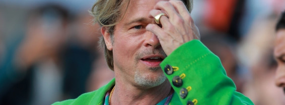 Brad Pitt arrives at the premiere of 'Bullet Train'  wearing a show-stopping bright green suit!