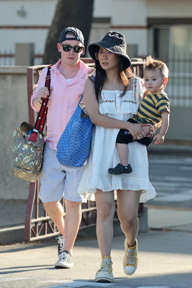 Former child superstar Macaulay Culkin is one proud papa as he enjoys a family day out with fiancŽe Brenda Song and their young son Dakota, 16 months, on a sunny afternoon in the LA suburbs.