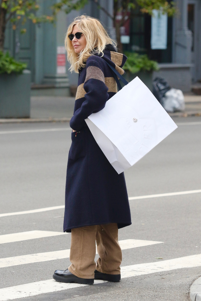 *EXCLUSIVE* Actress Meg Ryan is bundled up and all smiles during a cold windy day in NYC