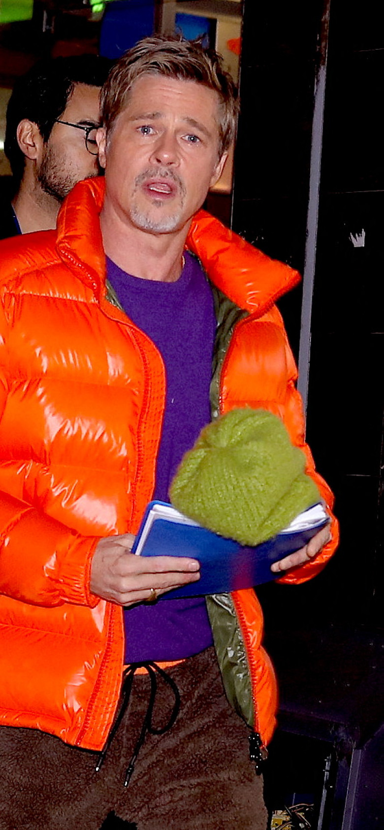 Brad Pitt signs autographs in orange bomber jacket as he heads to the makeup trailer on his 2nd day of filming with George Clooney in NYC