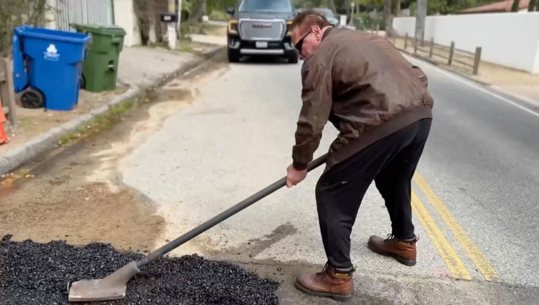 Hands-on Arnold Schwarzenegger fixes a giant pothole in his LA neighbourhood