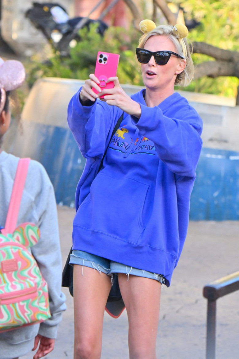 EXCLUSIVE: Charlize Theron has a super fun day at Disneyland